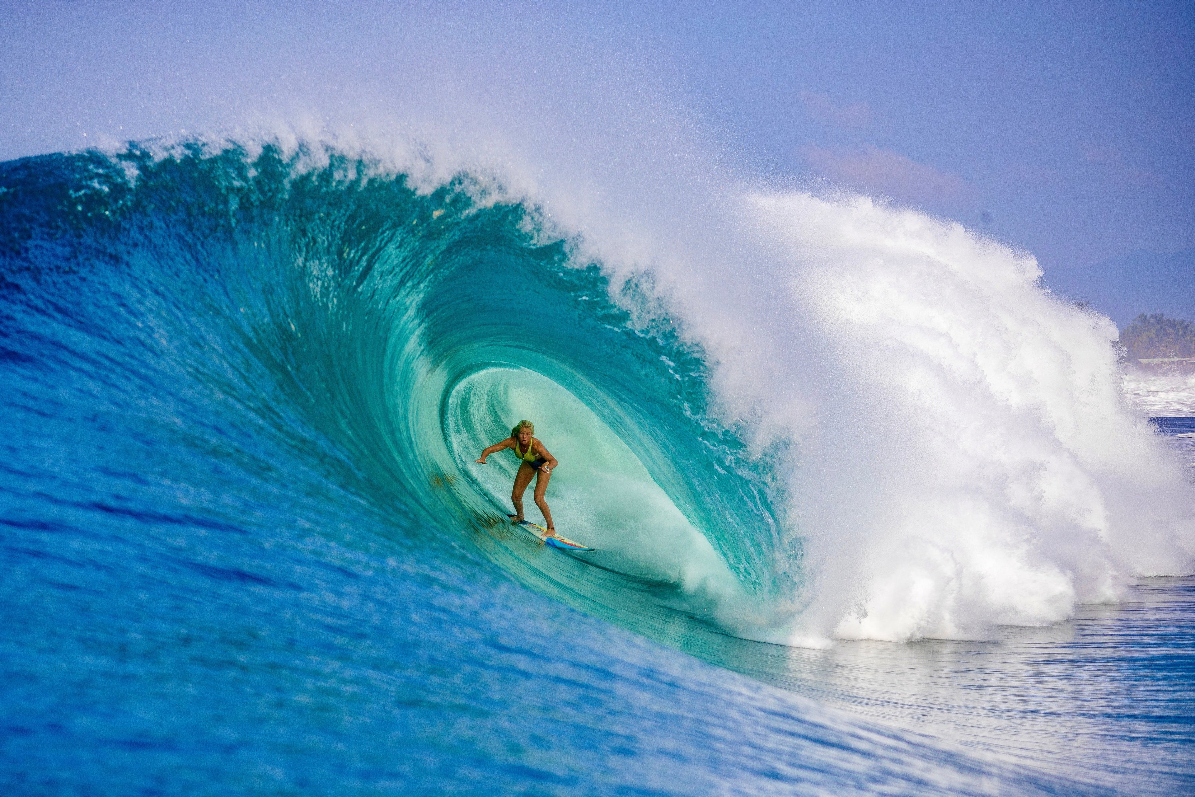 Eden Walla surfing a huge barrel wave